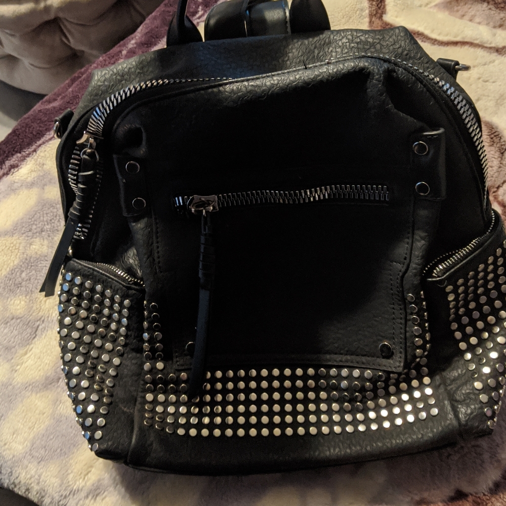 Black and silver studded backpack